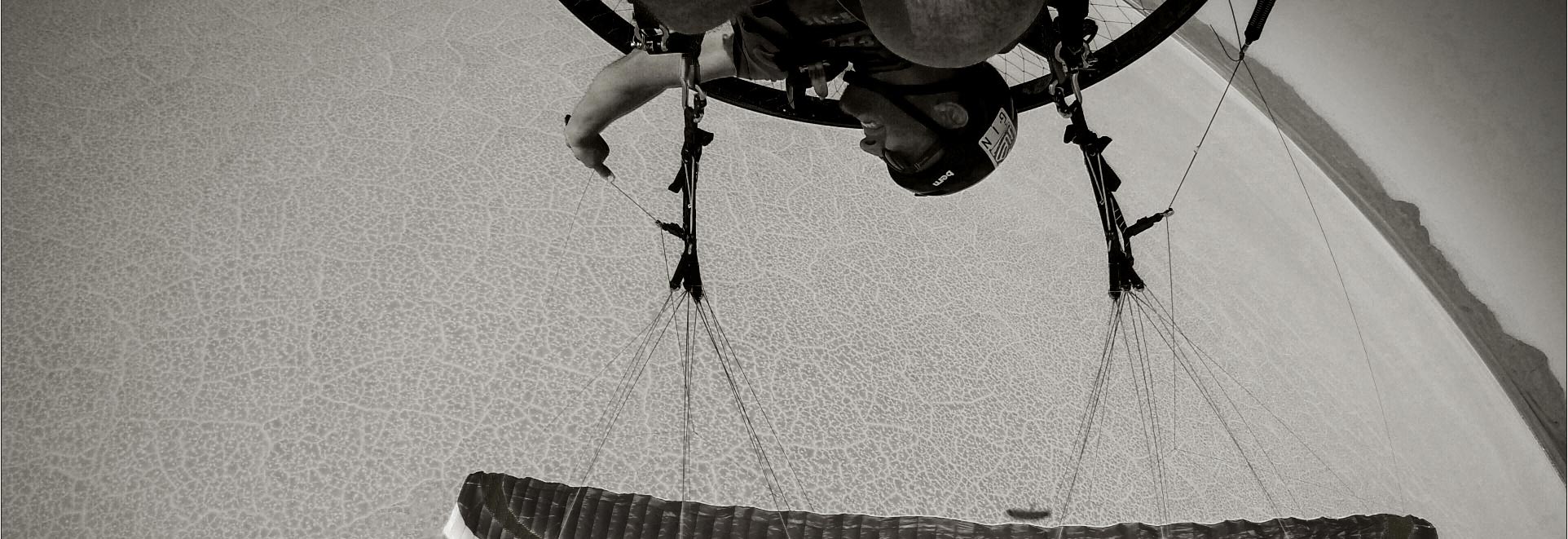 scout-carbon-paramotor-wing-over-salt-flats-california-1920-660-black-and-white